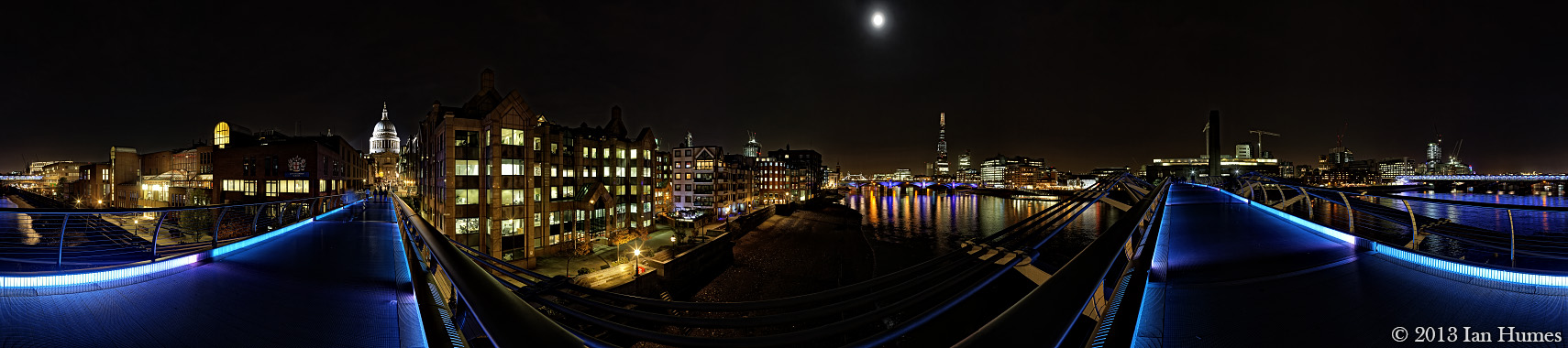 The Shard, St. Pauls Cathedral and the `Walkie Talkie` building photographed from the Millennium Bridge at night - London